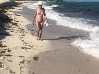 Laura walking naked at the beach