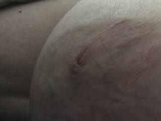 My BBW wife has a big pair of tits. Closeup on her right breast and nipple. She’d love a cock or cum tribute.
