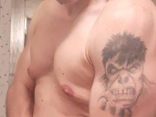 tattooed gym guy flixing in the mirror...