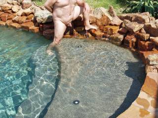 I stripped hubby of his swim trunks and told him to pose nude for some pool pics!