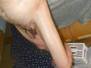 A partial side body view as I have one foot on the floor and the other on a small stool as I am in the process of standing near the kitchen island... Late April 2024... FZ 150 camera was used.