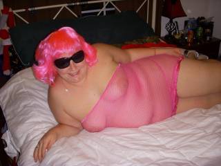 Jen posing for ZOIG in her sexy pink Fishnet Dress.