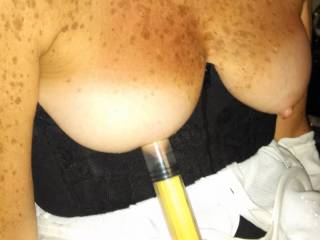 Applying the nipple pump on the wife