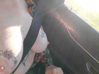 Seatbelt on for safety... Tits out because its dangerous to keep them covered!  LOL
Classy art should be on show!