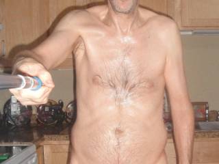 A partial body selfie as I stand near my stove after some toy play...September 2025.  1 of 2 Sony 290 camera`s was used.