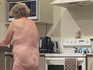 My 65 year old granny friend doing dishes naked