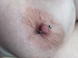 Nice and hard from sucking her pierced nipple….
