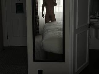 Naked and very horny. Do hotel rooms have that effect on anyone else?