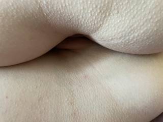 My wife shows me, from behind, the treasures between her buttocks