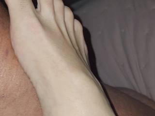 Rubbing his cock with my sexy feet