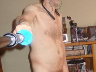 A partial body selfie as I stand after rubbing/smearing tong balm on my dick a 2ND... that`s why my dick is red in color...late April 2025... Sony H90 camera was used.