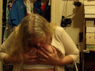 her licking her nipples